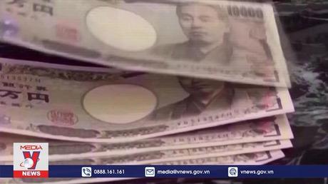 Nhật Bản hạ dự báo tăng trưởng kinh tế