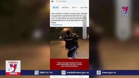 Xử phạt thanh niên ''bốc đầu'' xe máy