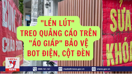 Lén lút treo quảng cáo trên ”áo giáp” bảo vệ bot điện, cột đèn